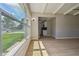 Bright living room with large window and durable wood floors at 2017 Waikiki Way, Tampa, FL 33619
