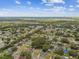 A tranquil residential neighborhood shown from above, with lush trees dotting the landscape and peaceful streets at 2027 Balfour Cir, Tampa, FL 33619