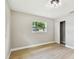 Bedroom with neutral walls, light flooring, a window and a closet with sliding doors at 2027 Balfour Cir, Tampa, FL 33619