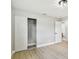 Bedroom featuring neutral walls, closet, light flooring and a door leading to another room at 2027 Balfour Cir, Tampa, FL 33619
