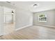 Inviting bedroom showcases neutral paint, light flooring, a large window, and ample natural light at 2027 Balfour Cir, Tampa, FL 33619