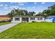 A welcoming single-story house with a green lawn and simple, elegant landscaping at 2027 Balfour Cir, Tampa, FL 33619
