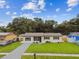 Lovely single-Gathering home with a neatly maintained lawn, fresh landscaping, and a welcoming front entrance for immediate curb appeal at 2027 Balfour Cir, Tampa, FL 33619