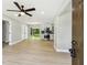 An open-concept living space with new floors flowing into the modern kitchen at 2027 Balfour Cir, Tampa, FL 33619