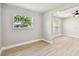 Open layout living room with new flooring and great natural light throughout the room at 2027 Balfour Cir, Tampa, FL 33619