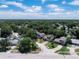 Aerial view of neighborhood highlighting property's location within a residential area with mature trees at 208 Se Lincoln N Cir, St Petersburg, FL 33703