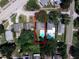 Aerial view of a property featuring a swimming pool in a private backyard at 208 Se Lincoln N Cir, St Petersburg, FL 33703