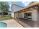 Covered patio with pool view, providing shade and an ideal space for outdoor gatherings at 208 Se Lincoln N Cir, St Petersburg, FL 33703