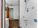 Bathroom with tiled shower and fixtures at 208 Se Lincoln N Cir, St Petersburg, FL 33703