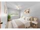 Bright bedroom with modern decor, neutral tones, and large window at 208 Se Lincoln N Cir, St Petersburg, FL 33703