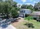 Charming home with well-maintained landscaping, a two car garage and inviting curb appeal at 208 Se Lincoln N Cir, St Petersburg, FL 33703