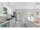 Bright kitchen featuring stainless appliances, granite countertops, and a large island at 208 Se Lincoln N Cir, St Petersburg, FL 33703
