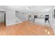 Spacious living room featuring hardwood floors and an open floor plan with easy access to the kitchen at 208 Se Lincoln N Cir, St Petersburg, FL 33703