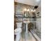 Renovated bathroom with custom tile, pedestal sink, and glass enclosed shower at 2192 Robinson Dr, St Petersburg, FL 33710