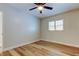 Bright bedroom has wood floors, a ceiling fan, and a large window at 2192 Robinson Dr, St Petersburg, FL 33710