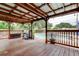 Backyard view from the wooden deck, with the pool visible beyond the wooden railing at 2192 Robinson Dr, St Petersburg, FL 33710