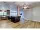 Open kitchen with kitchen island, stainless steel appliances, and a view into the living room at 2192 Robinson Dr, St Petersburg, FL 33710