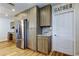 Kitchen area with wood cabinets, marble counters, stainless steel appliances, and a pantry at 2192 Robinson Dr, St Petersburg, FL 33710