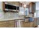 Kitchen area showcasing modern stainless steel appliances, granite countertops, and stylish cabinets at 2192 Robinson Dr, St Petersburg, FL 33710