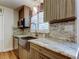Modern kitchen featuring stainless steel appliances, marble countertops, and stylish cabinetry at 2192 Robinson Dr, St Petersburg, FL 33710