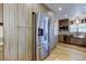 Modern kitchen featuring stainless steel appliances, pantry, and stylish wood-look cabinetry at 2192 Robinson Dr, St Petersburg, FL 33710