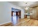 Kitchenette area with wood cabinets, marble counters, stainless steel appliances, and a view into the sunroom at 2192 Robinson Dr, St Petersburg, FL 33710
