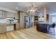 Beautiful kitchen with stainless steel refrigerator, wood cabinets, and a large kitchen island at 2192 Robinson Dr, St Petersburg, FL 33710