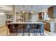 Modern kitchen featuring a large island with seating, stainless steel appliances, and stylish cabinetry at 2192 Robinson Dr, St Petersburg, FL 33710