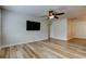 Bright living room features modern flooring, fan, and a wall-mounted TV at 2192 Robinson Dr, St Petersburg, FL 33710
