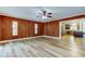 Spacious living room with wood floors, paneled walls and lots of natural light at 2192 Robinson Dr, St Petersburg, FL 33710