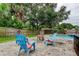 Relaxing backyard patio with comfortable seating and views of the lush greenery at 2192 Robinson Dr, St Petersburg, FL 33710