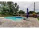 Backyard pool with brick pavers and a small spa is surrounded by a wooden fence at 2192 Robinson Dr, St Petersburg, FL 33710