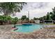 Backyard featuring a pool, spa, and a well-maintained brick patio at 2192 Robinson Dr, St Petersburg, FL 33710