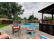 Outdoor pool area with comfortable chairs, a spa, and cabana providing a relaxing space at 2192 Robinson Dr, St Petersburg, FL 33710