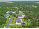 An aerial property outline featuring the home, the pool, the detached garage, and the surrounding landscape at 2513 Martucci Rd, Seffner, FL 33584