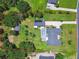 An aerial outline of the property, highlighting the house, garage, pool and mature trees at 2513 Martucci Rd, Seffner, FL 33584