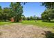 The orange detached garage in the backyard is set back from the main house at 2513 Martucci Rd, Seffner, FL 33584