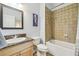 Bathroom with granite vanity top, tiled shower-tub, and modern fixtures providing a clean and functional space at 2513 Martucci Rd, Seffner, FL 33584