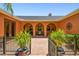 Enclosed courtyard features an outdoor seating area and charming architectural details, ideal for relaxation at 2513 Martucci Rd, Seffner, FL 33584