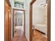 Hallway with tile floors and view to bedroom and a safe in another room at 2513 Martucci Rd, Seffner, FL 33584