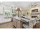Spacious kitchen featuring a large island with seating, stainless appliances, and tile floors at 2513 Martucci Rd, Seffner, FL 33584