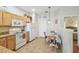 Functional kitchen with wooden cabinets, granite countertops, and tile flooring at 2513 Martucci Rd, Seffner, FL 33584