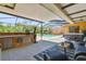 Lanai with seating, outdoor kitchen, pool and hot tub at 2513 Martucci Rd, Seffner, FL 33584