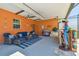 Lanai with seating area, outdoor kitchen, and Pirate statue at 2513 Martucci Rd, Seffner, FL 33584