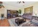 Comfortable living room features a plush sofa, a large TV, and a stylish area rug at 2513 Martucci Rd, Seffner, FL 33584