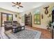 The living room offers tile floors, ceiling fan, arched windows, and backyard views at 2513 Martucci Rd, Seffner, FL 33584