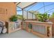 Outdoor kitchen with stainless steel cabinets, granite countertops, and Tiki decor at 2513 Martucci Rd, Seffner, FL 33584