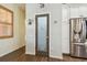 Kitchen pantry door with decorative glass insert, matching the cabinet colors and design at 2513 Martucci Rd, Seffner, FL 33584