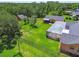 Aerial view highlighting home, fenced yard, screened pool enclosure and detached garage at 2513 Martucci Rd, Seffner, FL 33584