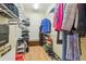 Organized walk-in closet featuring shelves, hanging rods, and a variety of storage options for shoes and clothing at 2513 Martucci Rd, Seffner, FL 33584
